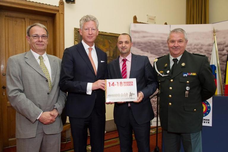The authors of the book with the Minister : Major Rob Troubleyn, First Sergeant-Chief Malek Azoug and Adjudant Patrick Brion The authors of the book with the Minister : Major Rob Troubleyn, First Sergeant-Chief Malek Azoug and Adjudant Patrick Brion